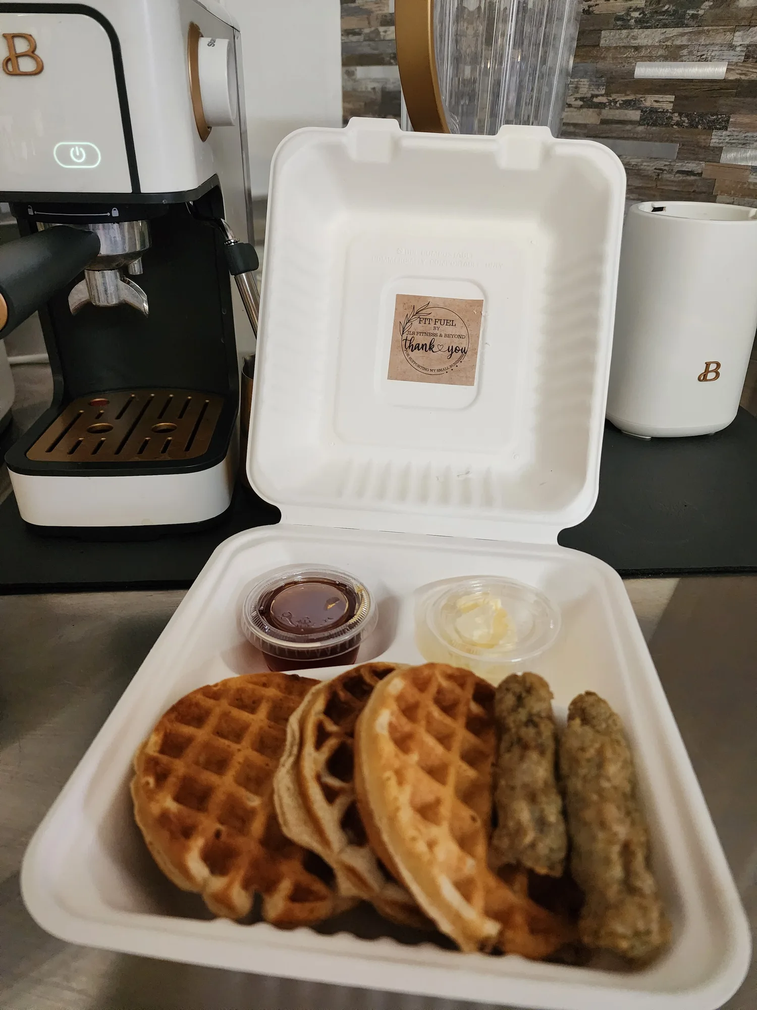 Waffles and sausage breakfast from Fit Fuel Cafe